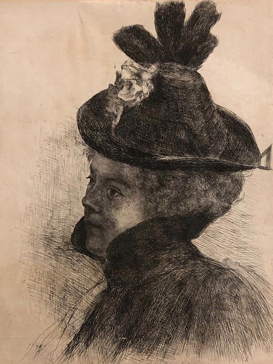 Young woman with cape and hat