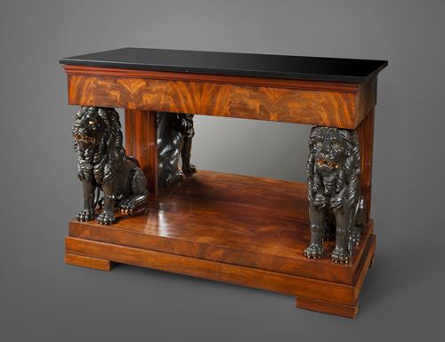 An imposing Empire console table with seated carved wooden lions