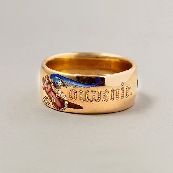 A Gold and Enamel Victorian Bangle with the word Souvenir in Diamonds