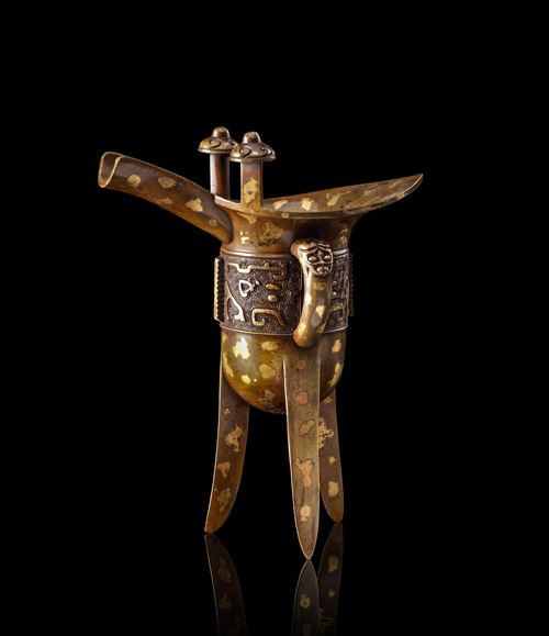 Gilt-splashed bronze tripod wine vessel